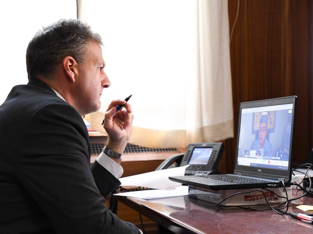 Gov. Chris Sununu posted this photo on Twitter of him and other governors talking with Pfizer CEO Albert Bourla on Thursday.