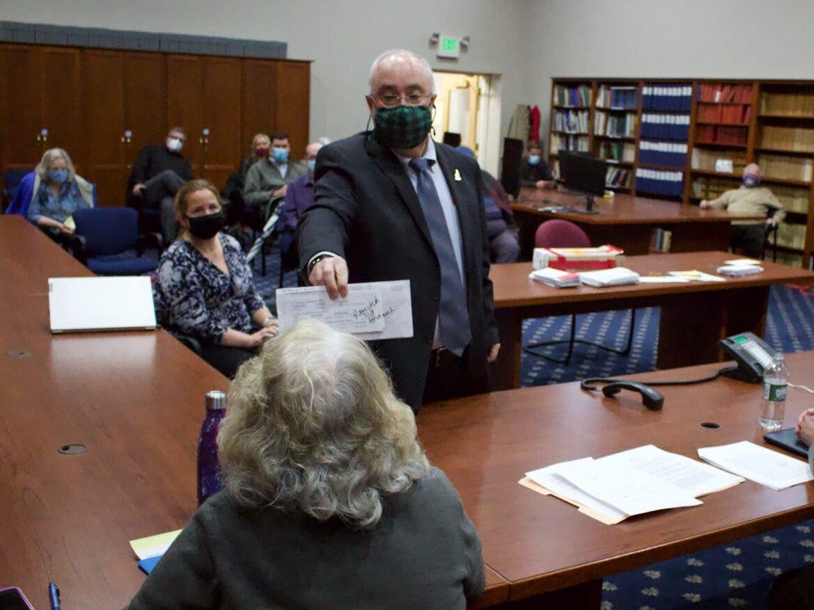 Bud Fitch of the Secretary of State's Office, shows a rejected ballot Nov. 23, 2020, during a Ballot Law Commission meeting.