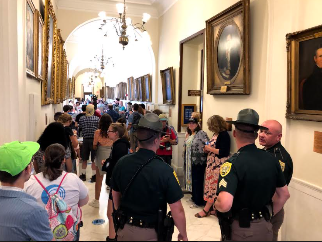 State Police were called Thursday when protesters entered the State House to tell Gov. Chris Sununu to veto the budget.