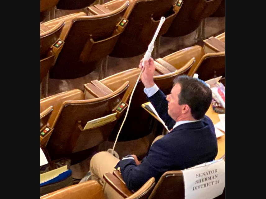 State Sen. Tom Sherman, D-Rye, holds up the medical wand used to perform transvaginal ultrasounds. Women in New Hampshire who want to get an abortion must get an ultrasound first if Gov. Chris Sununu signs the budget passed Thursday as expected.