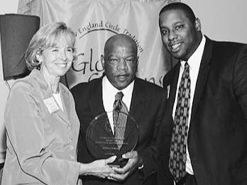 Eleanor Dunfey Freiburger is pictured with John Lewis and Tito Jackson.