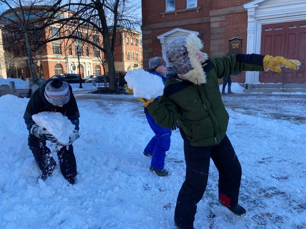 Camden Johnson, 12, Carter Wiles, 11, and Michael Makum, snowball fighters from Kittery, Maine, made fun off the weekend storm in Portsmouth.