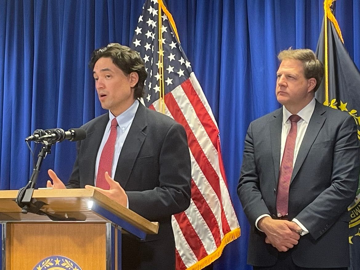 State epidemiologist Dr. Ben Chan is pictured with Gov. Chris Sununu behind him at a news conference in Concord on Wednesday.