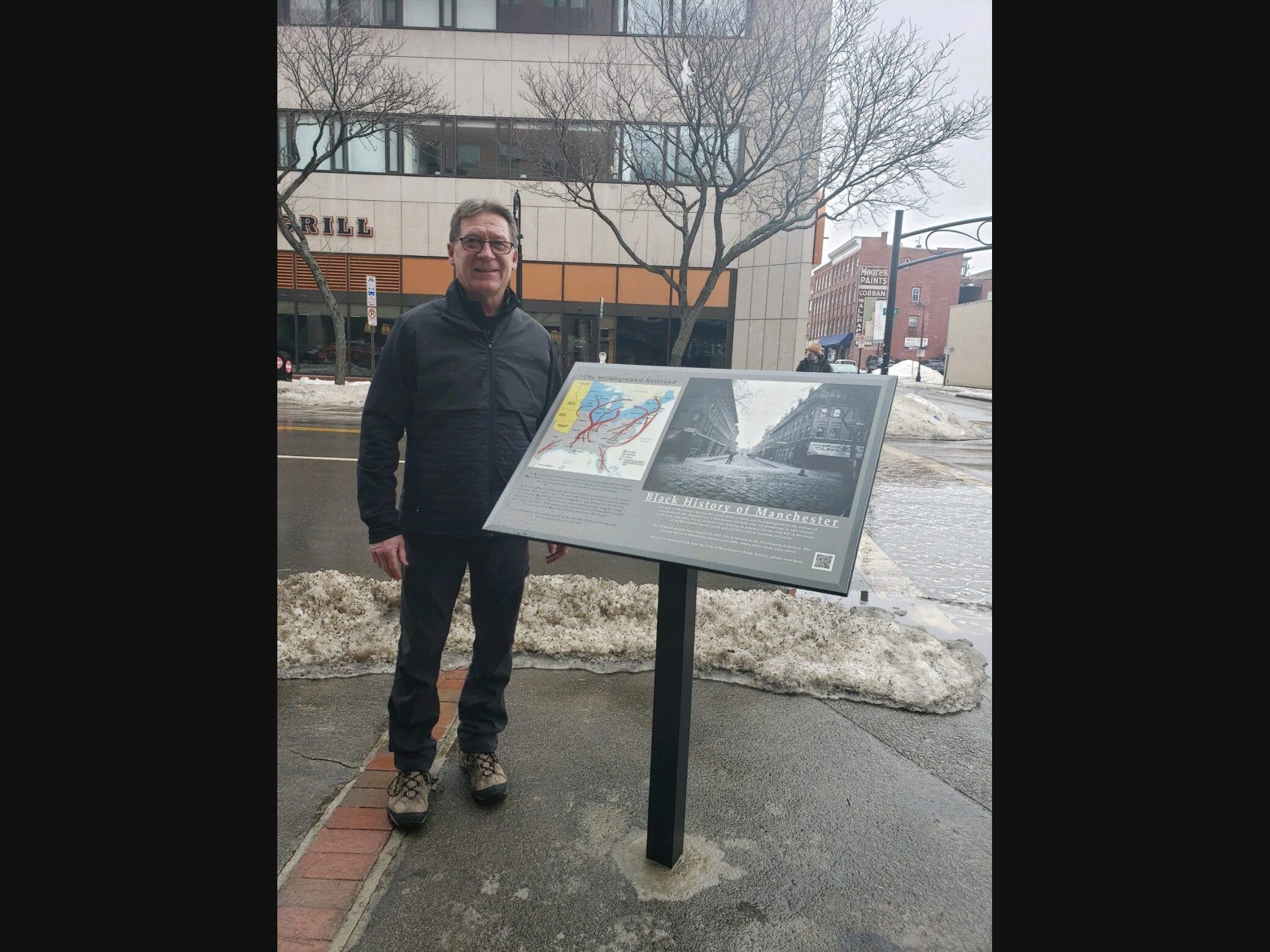 Stan Garrity is pictured next to the first marker that was placed at the corner of Elm and Manchester streets in the center of the city just in time for February, which is Black History month across the nation.