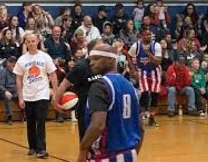 At left is former Winchester police officer Joshua Edson at a charity basketball game.