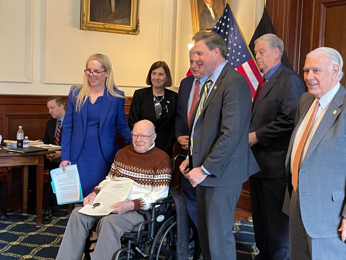 Governor and Executive Councilors honor Joseph Raymond "Red" Goulet of Portsmouth. From left standing with Goulet: Executive Councilors Janet Stevens, Cinde Warmington, Joe Kenney, Gov. Chris Sununu, David Wheeler, and Ted Gatsas.