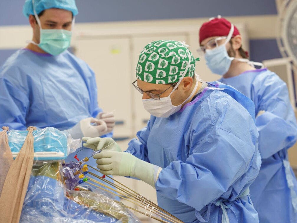Joshua P. Aronson, MD, a neurosurgeon at Dartmouth-Hitchcock Medical Center (DHMC), is pictured here during the procedure to implant a neurostimulator device targeting four areas of the brain into Jessica Sargent, an epilepsy patient. 