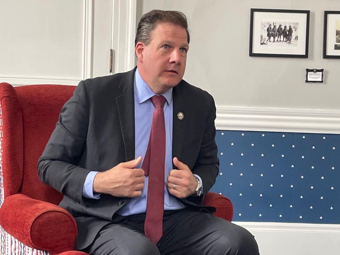 Gov. Chris Sununu speaks with reporters in his office after the Executive Council meeting Wednesday.