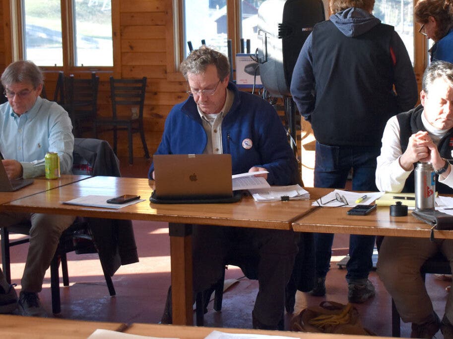 Gunstock Area Commissioners Doug Lambert, David Strang, and Peter Ness prepare for the start of the April 20 meeting at Gunstock. (Tom Caldwell Photo)