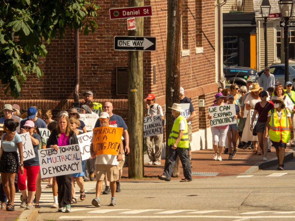 ARNIE ALPERT photo
 
Democracy walkers in the streets of Portsmouth on Sunday.