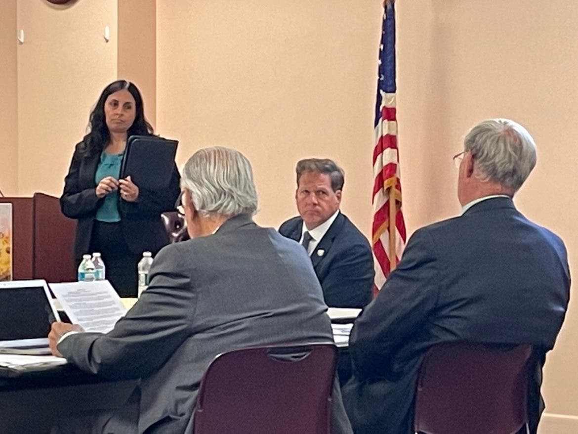 NH Health and Human Services Commissioner Lori Shibinette is pictured standing next to Gov. Chris Sununu at Tuesday's Executive Council meeting.