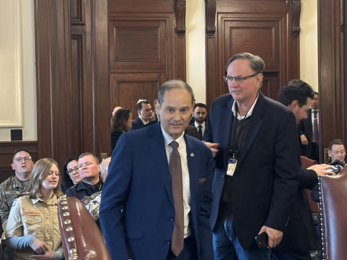 Executive Councilor John Stephen, left, is greeted by NH Journal publisher and managing editor Michael Graham at Jan. 7 Executive Council meeting at the State House. It was Stephen's first in-person meeting after suffering a heart attack.