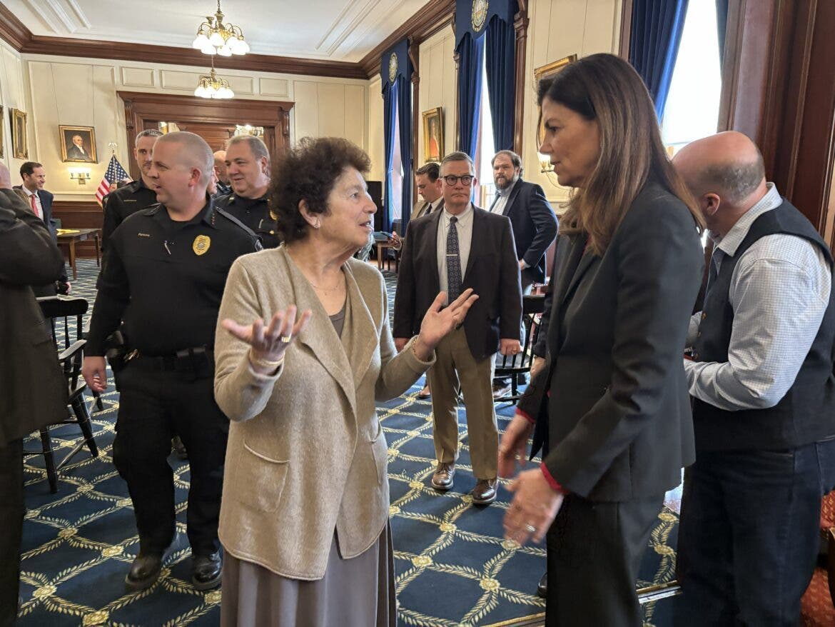 Sen. Cindy Rosenwald, D-Nashua, left is pictured speaking with Gov. Kelly Ayotte after she signed the new DWI breathalyzer law Monday at the State House.