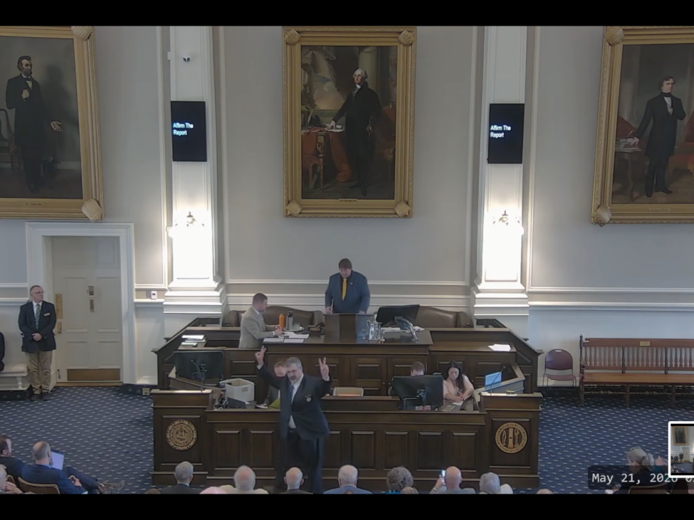 Rep. Travis Corcoran, R-Weare, gives either the victory or peace sign after he was censured by the House Thursday for social media posts he made targeting fellow House members.
