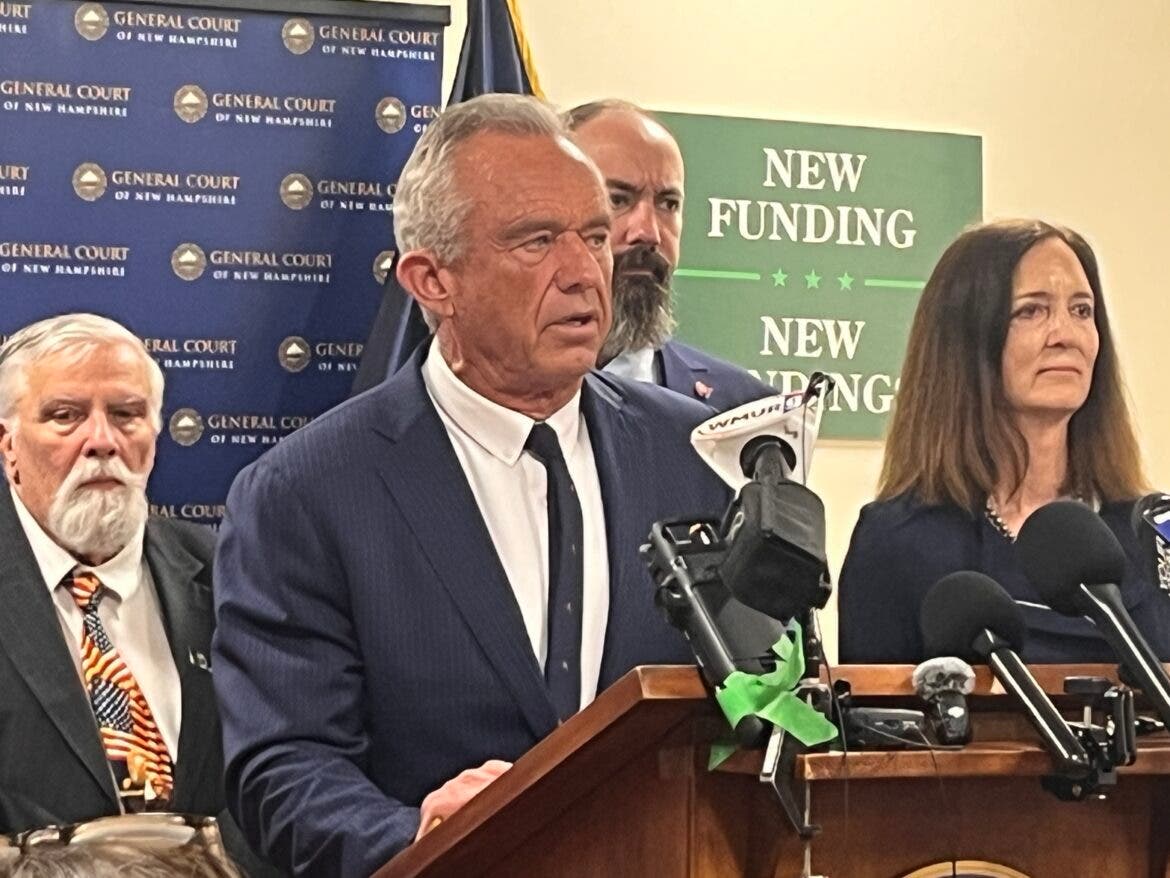 Secretary Robert F. Kennedy Jr. speaks at the State House on Friday. Behind him, from left: Speaker of the House Sherman Packard, R-Londonderry, House Majority Leader Rep. Jason Osborne, R-Auburn, Nancy Dougherty, Johns Hopkins Lyme Disease Research.