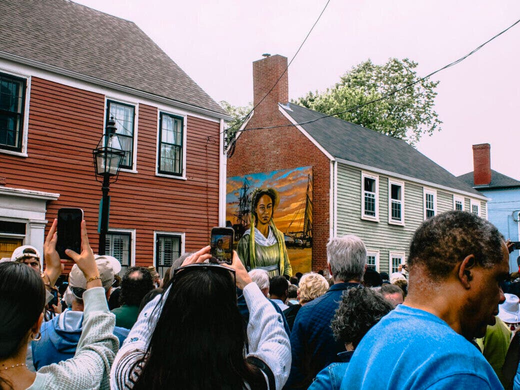 Photo of the Ona Judge Mural Unveiling event. Mural by Manny Ramirez, Positive Street Art.