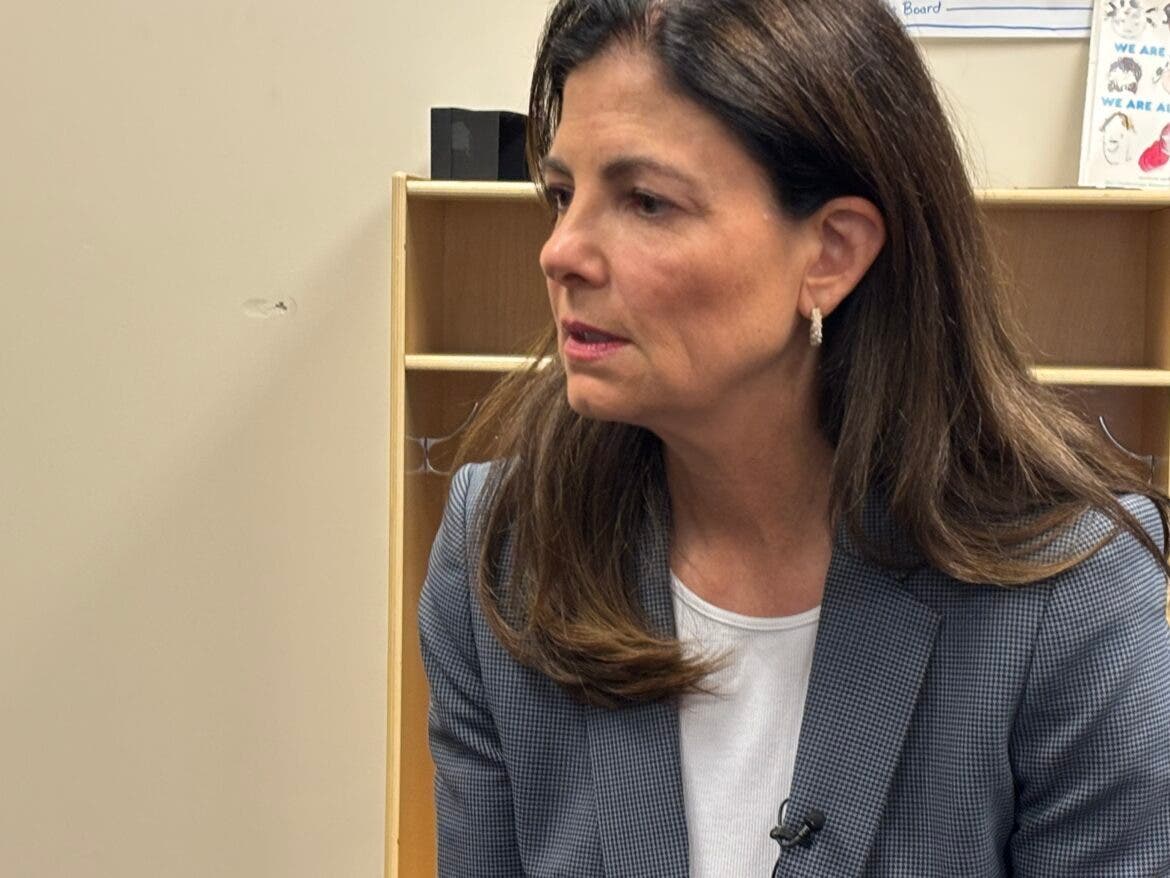 Gov. Kelly Ayotte is pictured speaking with reporters in Nashua on Wednesday.