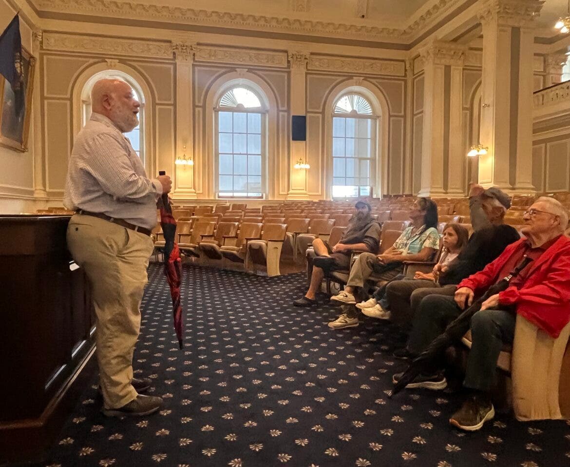 Free Stater Rep. Dan McGuire, R-Epsom, gives a tour of Representatives Hall at the State House to a group of visitors. McGuire was recently given the Lifetime Achievement Award by the New Hampshire Liberty Alliance.