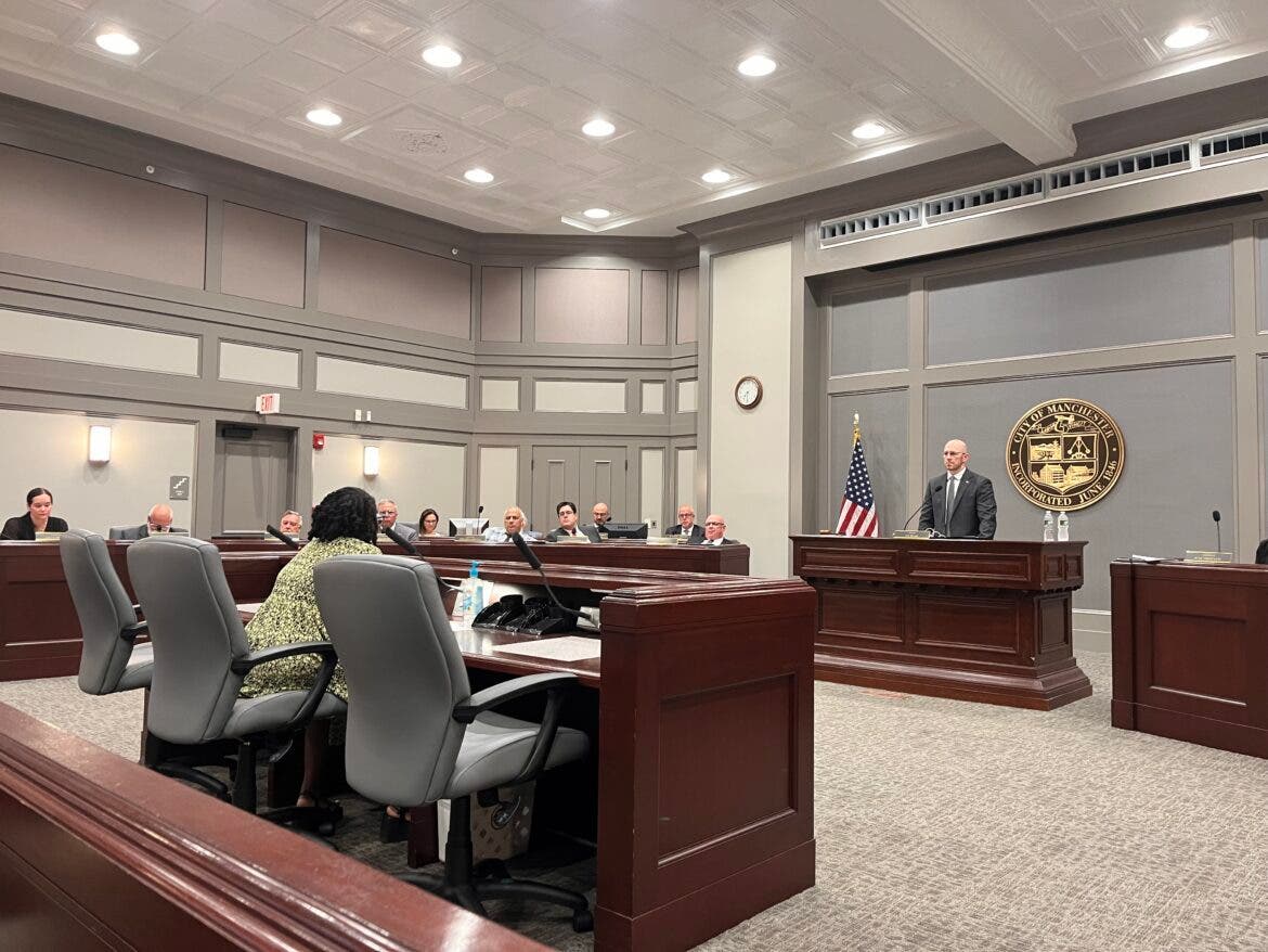 Grace Kindeke, director of projects for the New Hampshire Center for Justice and Equity, speaks at the Board of Mayor and Aldermen meeting on Tuesday evening.