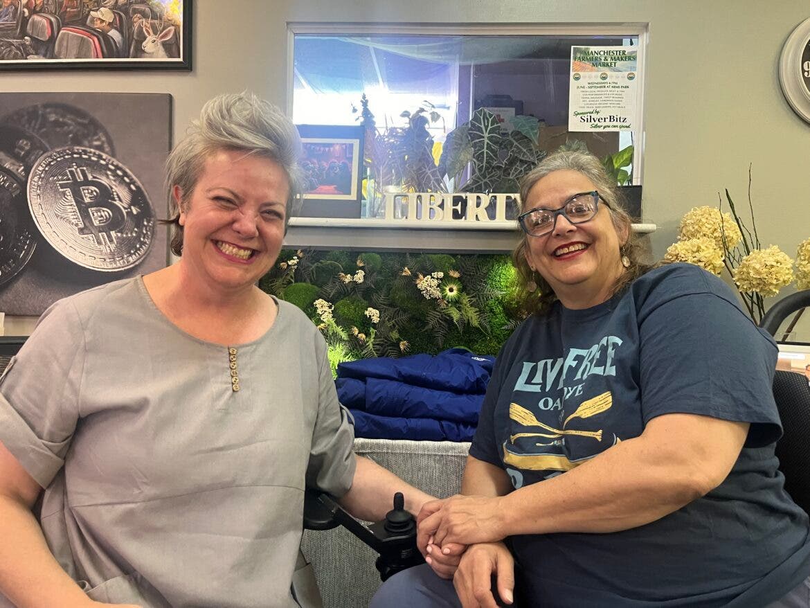 Carla Gericke, president emeritus of the Free State Project, sits beside Chris Lopez, welcoming and engagement director at the Quill in Manchester on in June for PorcFest.