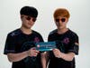 Stars of the Florida Mayhem gaming team FATE (left) and Byrem (right) display a special Gift of Life Marrow Registry swab kit, as part of the first-ever nonprofit partnership between the Mayhem, the Misfits esports league, and Gift of Life.
