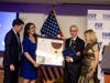 Steve Weil and Jennifer Scher giving award to Bobby and Lorraine Cohen