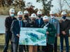 Representatives from OCC, architect and construction companies display rendering of new Science & Technology Building at "Beam Signing" ceremony 