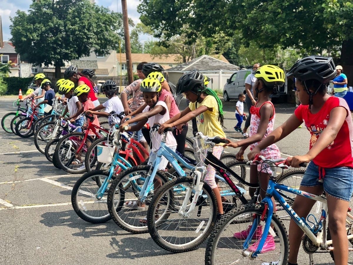 Children test out their new bikes at a summer 2019 event hosted by Family Promise and Hilltop Bicycles.