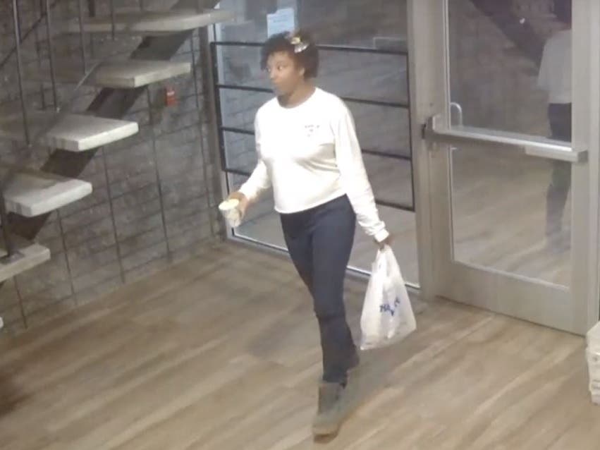 Surveillance video shows the delivery person arriving with food, and leaving with a bin full of stolen packages, say police..