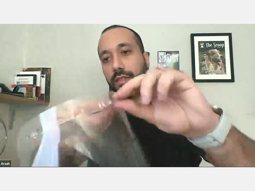 Using acrylic, a rubber band and transparency film for projectors, Malek created a shield that can easily be taken apart and cleaned. 