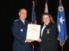 Lt Col Nicole Shaffner, CAP, receives a National Commander's Commendation from Maj General Mark Smith, CAP.