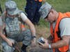 1Lt Norwood Bodie, CAP, at right, examines equipment used in search and rescue exercises, along with Cadet 2d Leiutenant Victoria Lang, CAP.