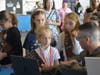 Cadet Captain Payton Mercer, CAP, teaches Girl Scouts about the flight simulators at Girls in Aviation Day. 