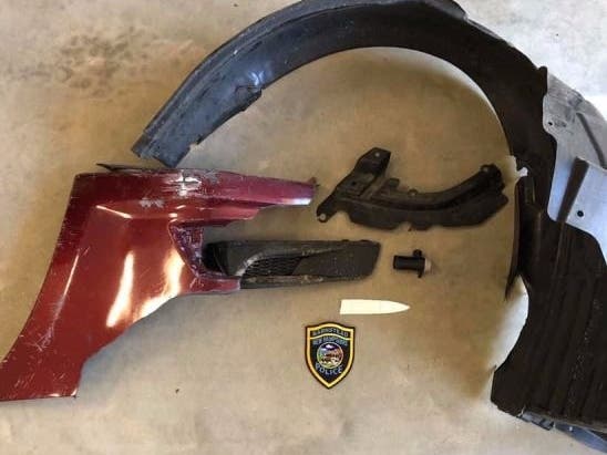 Pieces of a car left behind after a hit-and-run that left a Golden Retriever dead.