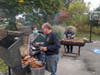 Larry at the BBQ grill with health inspector, 2021