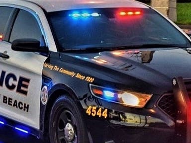  South Florida police are searching for a man who was captured on video helping himself to a snack as he robbed a Taco Bell.