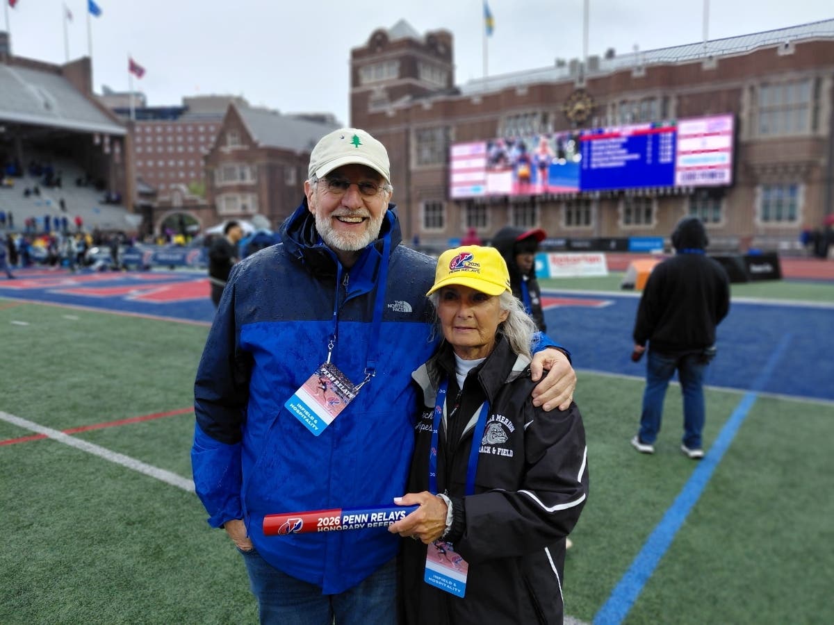 Coach Hoopes poses with her brother Dr. Spencer Niles After Receiving Penn Relays Honor 