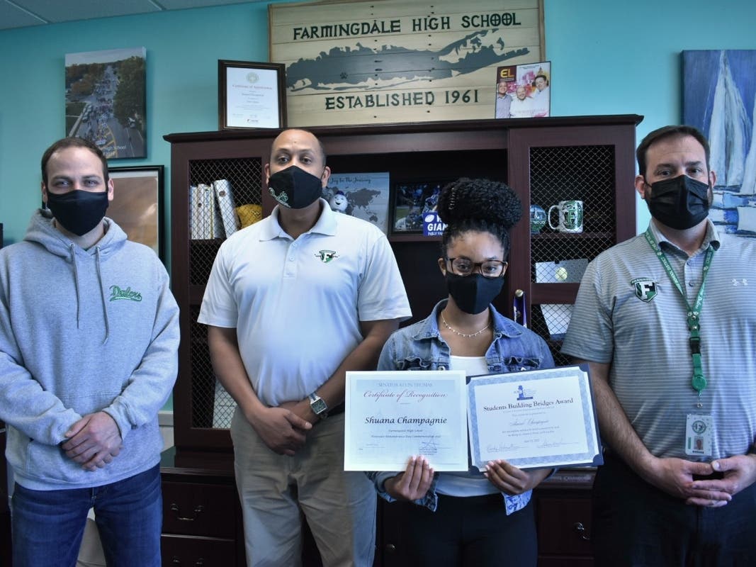 FHS social studies teacher Matt Cillis, FHS Principal Dr. Samuel Thompson, FHS senior Shuana Champagnie, and FHS Assistant Principal Jed Herman