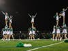 Farmingdale High School’s Varsity Cheer performs during halftime at Homecoming
