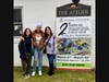 Farmingdale High School advanced placement art students Kira Moscoso and Amya Johnson with art teacher Cara Martin. Kira’s work, The Tools for Expression, is featured on the exhibit signage.
