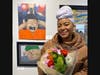 Farmingdale High School advanced placement art student Amya Johnson with her oil on canvas work Freeze. 
