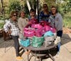 DAR members fill a stack of home-sewn Dopp Kits with toiletries for hospitalized veterans.