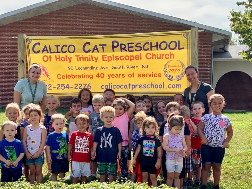 Calico Cat Preschool children on the front lawn of their school