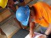 Merrimack Valley Habitat Building Director Emerson Dahmen Pictured right.