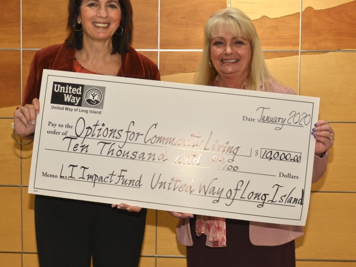 Options for Community Living, Inc. is presented with a check for $10,000 from United Way of Long Island. Options Executive Director Yolanda Robano-Gross with Patricia Rivers, United Way of Long Island Community Impact Program Director