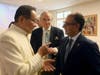 Dr. Hong, Tao-Tze, President of FOWPAL, left, and Ambassador Yusuf Abdulkarim Bucheeri of Bahrain to the UN (Vienna), exchange ideas about celebrating the United Nations' designation of April 5 as the International Day of Conscience. 