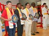 Dr. Hong, 3rd from left, presents the “compass clock of conscience” to, from left, Juan Ramon Lau Quan, MP of Guatemala; President of Burundian Constitutional Court Charles Ndagijimana; President of Burkina Faso’s Constitutional Council Kassoum Kambou.