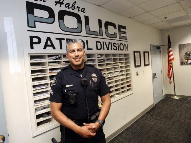 La Habra Police Corporal John Jaime poses for a picture on his last day at the La Habra Police Department on November 8, 2019. Corporal Jaime is retiring from the La Habra Police department after twenty-seven years working for the La Habra Police Departme