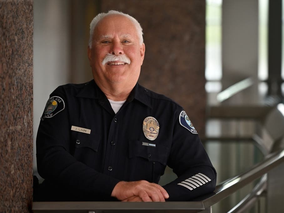 Retiring Santa Ana Police Detective Jeff Launi, whose 37 years in law enforcement is represented by the stripes on his sleeve — one bar for every five years completed.