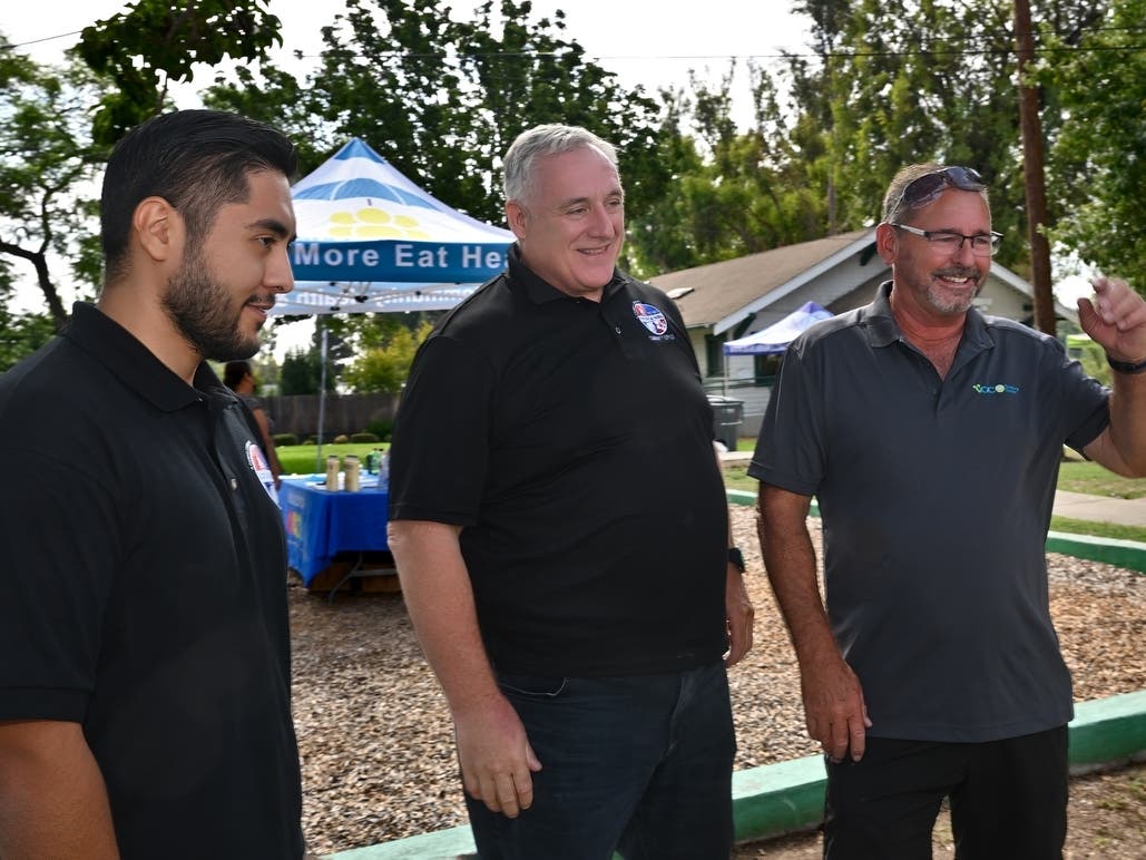 Community Outreach Liaisons David Aguirre, left, and Paul Mahoney with Scott Miller, executive director of La Habra Collaborative. 